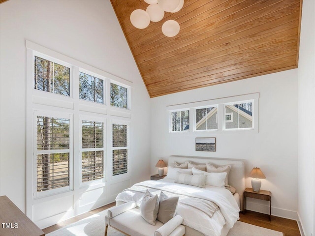 bedroom featuring wood ceiling, high vaulted ceiling, and hardwood / wood-style floors