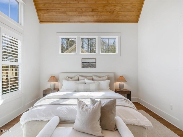 bedroom featuring wood-type flooring, lofted ceiling, and wood ceiling