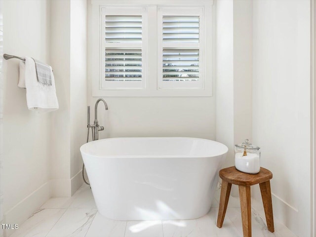 bathroom with a tub to relax in