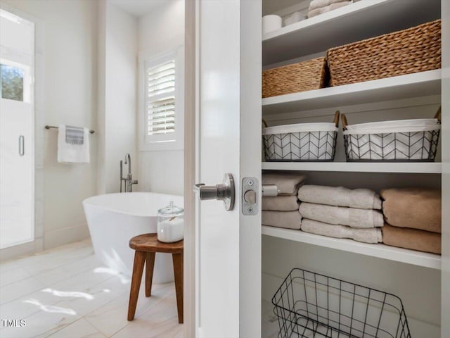 bathroom featuring a tub