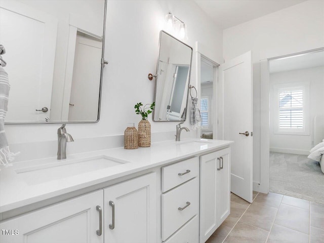 bathroom featuring tile patterned flooring and vanity