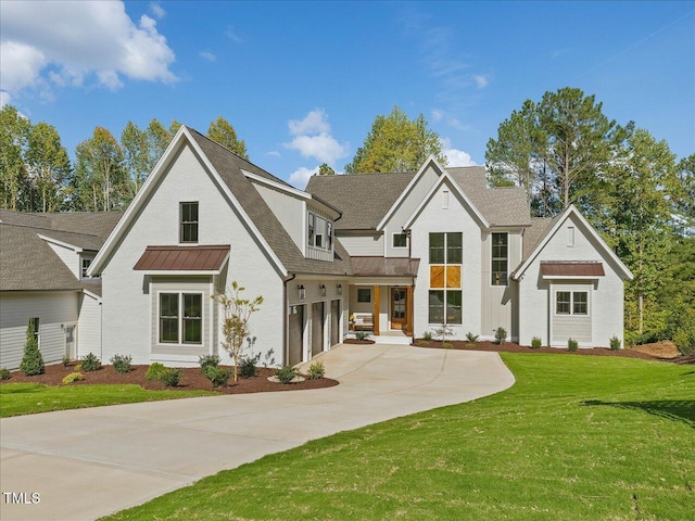 rear view of house with a garage and a yard