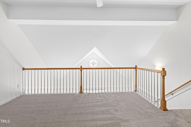 interior space with vaulted ceiling and carpet flooring