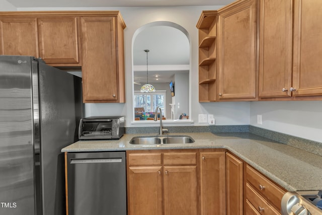 kitchen featuring stainless steel appliances, brown cabinets, a sink, and open shelves