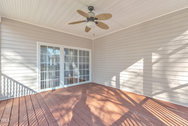 wooden deck featuring a ceiling fan