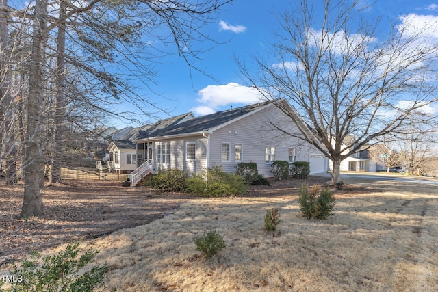 view of property exterior with an attached garage