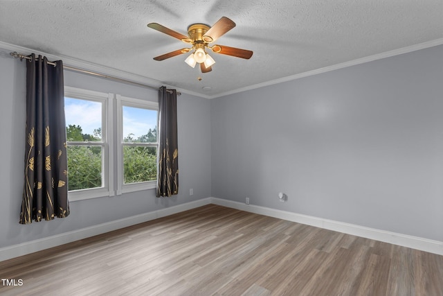 1167 John D Winstead Rd, Roxboro, NC 27574 - unfurnished room with wood finished floors, a textured ceiling, a ceiling fan, baseboards, and crown molding