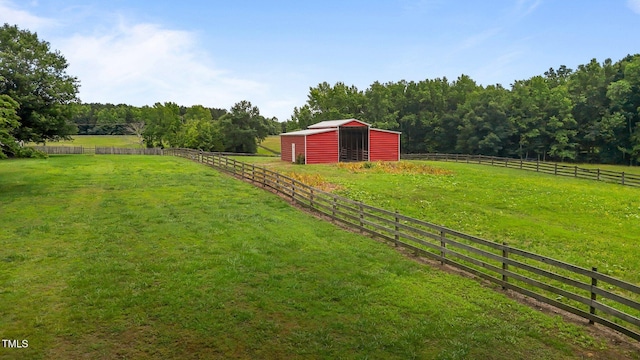 1167 John D Winstead Rd, Roxboro, NC 27574 - view of yard with an outbuilding, a view of countryside, a pole building, and an exterior structure