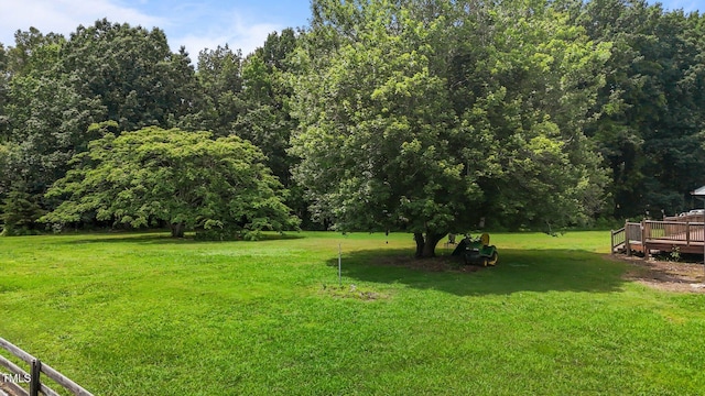 1167 John D Winstead Rd, Roxboro, NC 27574 - view of grassy yard featuring a deck and a forest view