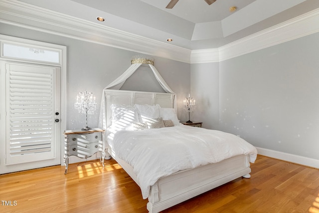 bedroom featuring crown molding, ceiling fan, and wood-type flooring