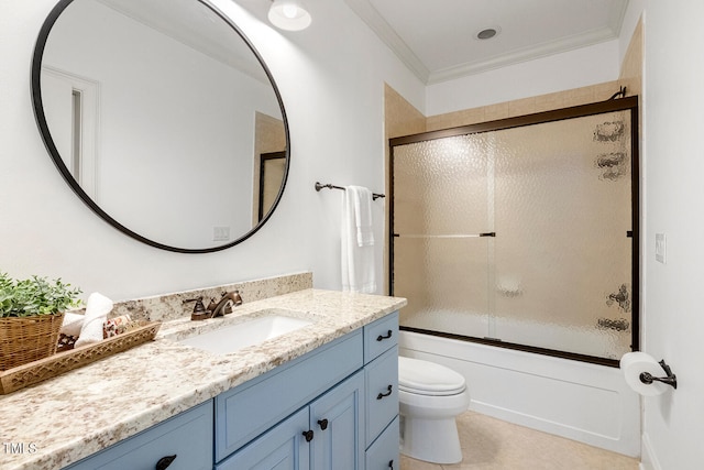 full bathroom featuring tile patterned floors, toilet, crown molding, vanity, and enclosed tub / shower combo