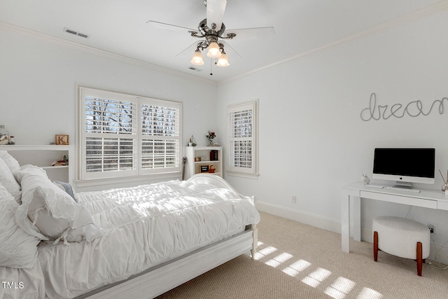 carpeted bedroom with crown molding and ceiling fan