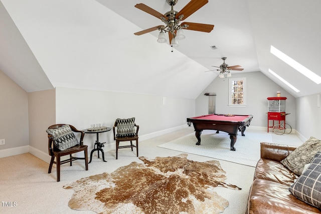 game room featuring lofted ceiling with skylight, light colored carpet, ceiling fan, and billiards