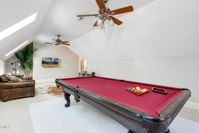 game room featuring ceiling fan, lofted ceiling with skylight, and carpet