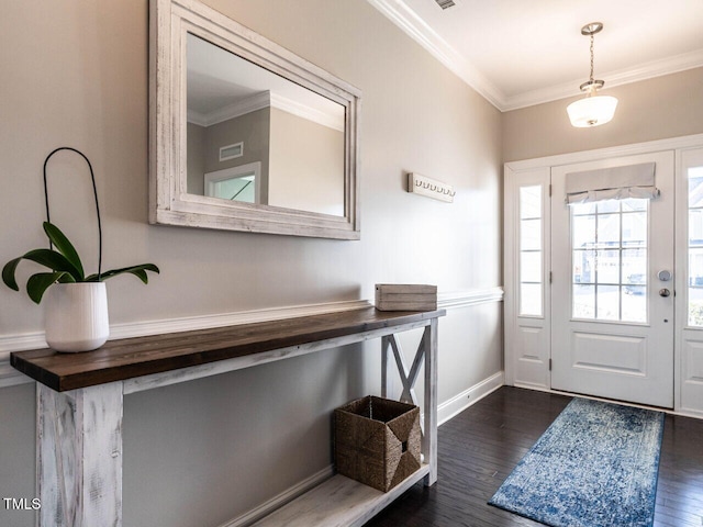 foyer entrance with dark wood-type flooring and ornamental molding