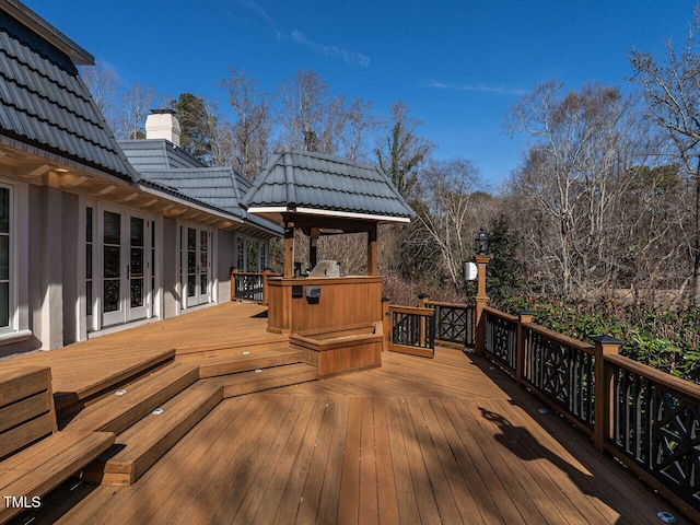 wooden terrace with area for grilling