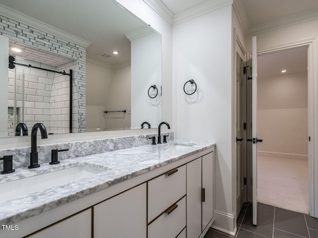 bathroom featuring crown molding, tile patterned floors, and vanity