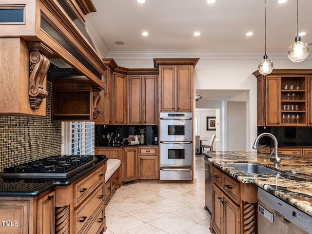 kitchen with tasteful backsplash, sink, dark stone counters, hanging light fixtures, and stainless steel appliances