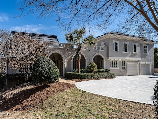 mediterranean / spanish-style home featuring a garage