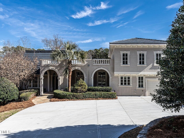 mediterranean / spanish-style home featuring a garage