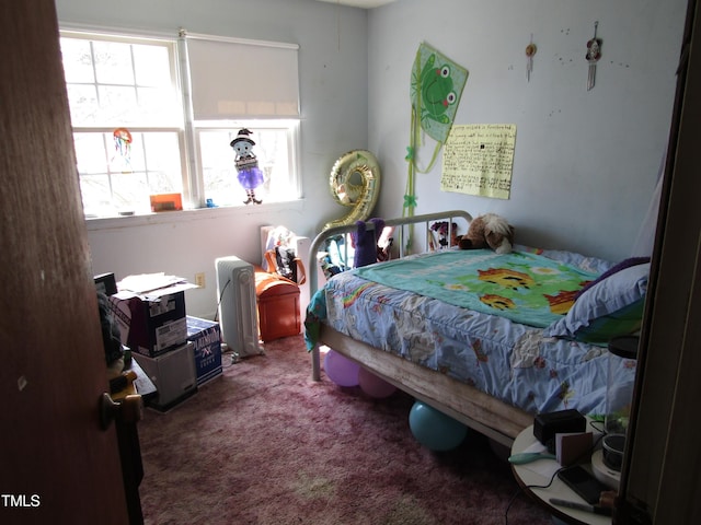 bedroom featuring carpet flooring and multiple windows