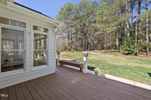 deck featuring a lawn