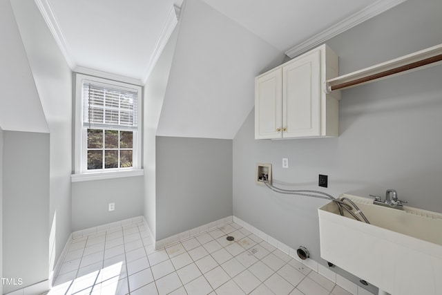 clothes washing area featuring crown molding, hookup for a washing machine, cabinet space, hookup for an electric dryer, and a sink