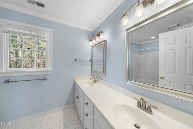 full bathroom featuring a sink, visible vents, double vanity, and crown molding