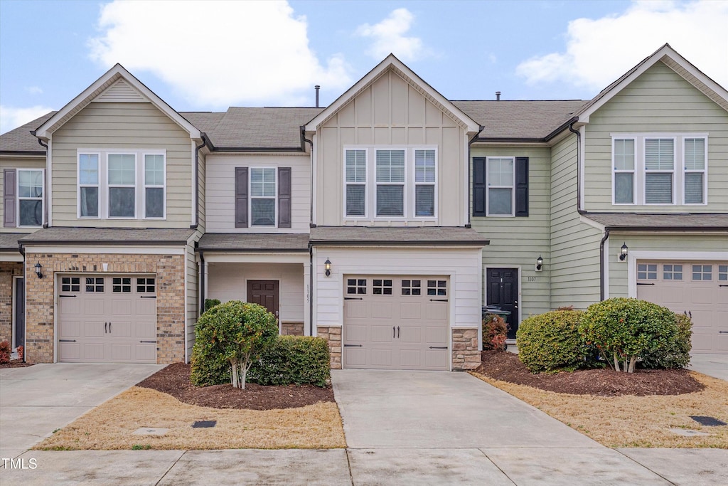 multi unit property featuring a garage