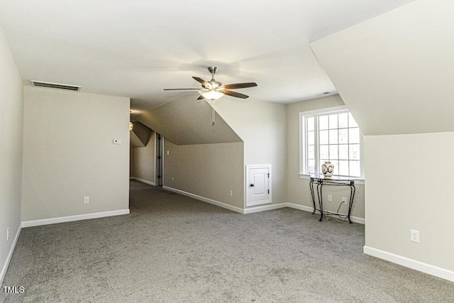 bonus room with ceiling fan, vaulted ceiling, and carpet