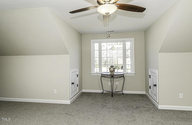 additional living space featuring ceiling fan, light colored carpet, and lofted ceiling