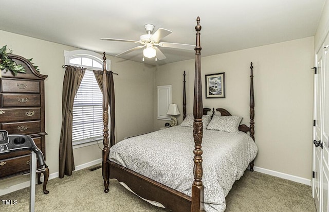 bedroom featuring ceiling fan and light carpet