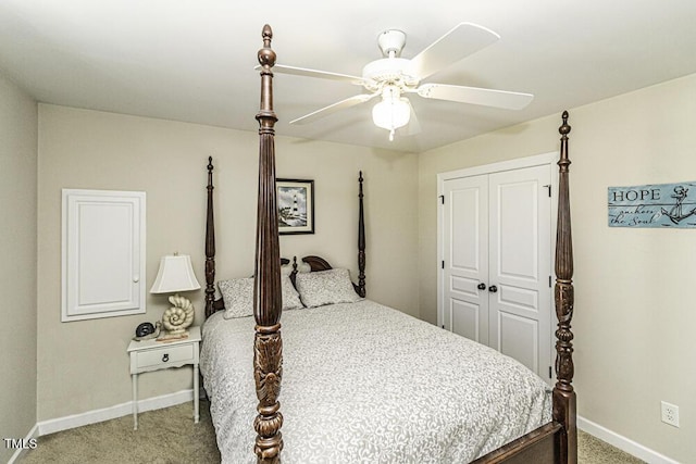 carpeted bedroom featuring a closet and ceiling fan