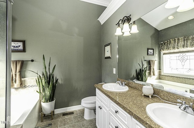 bathroom with vanity, a tub to relax in, ornamental molding, and toilet