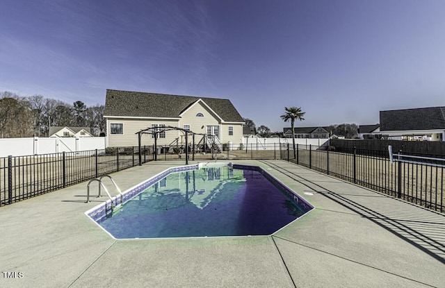 view of swimming pool featuring a patio area