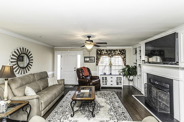 living room featuring crown molding, ceiling fan, and dark hardwood / wood-style floors