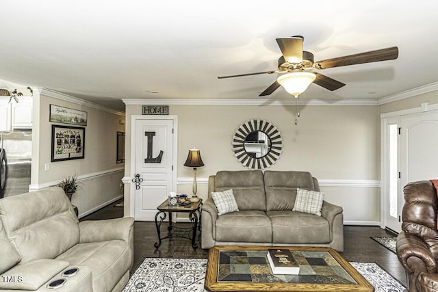 living room featuring dark hardwood / wood-style flooring, crown molding, and ceiling fan