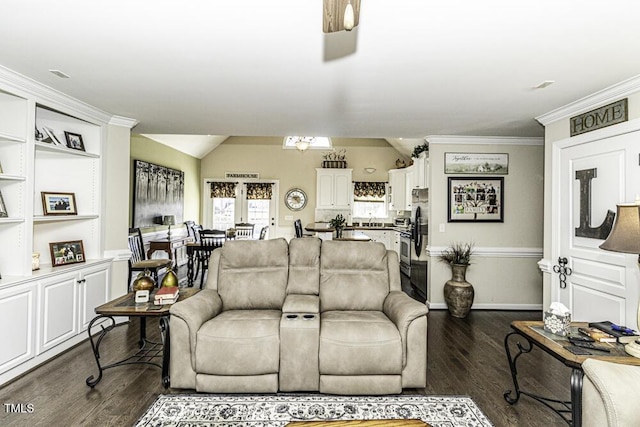 living room featuring dark hardwood / wood-style flooring, vaulted ceiling, ornamental molding, and ceiling fan