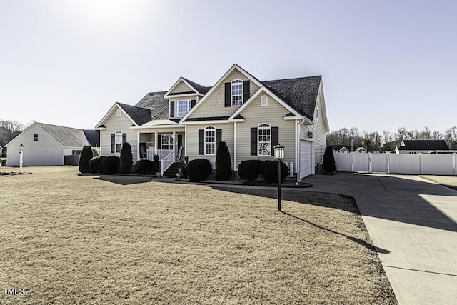 view of front of house featuring a garage and covered porch