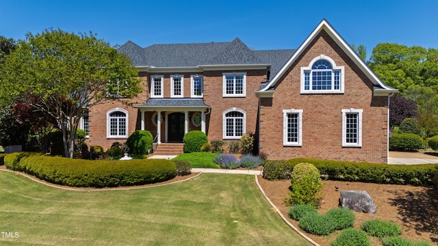 212 Whirlaway Ln, Chapel Hill, NC 27516 - colonial house featuring brick siding and a front yard