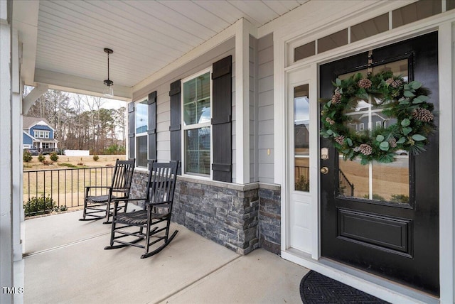 doorway to property with covered porch