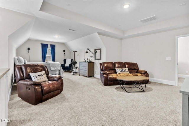 carpeted living room featuring lofted ceiling