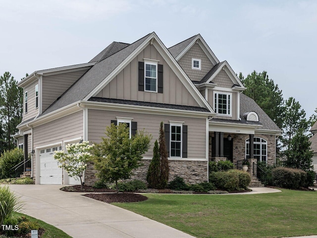 craftsman-style house featuring a garage and a front lawn