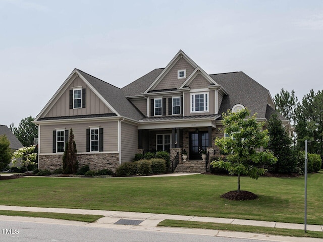 craftsman inspired home with a front lawn