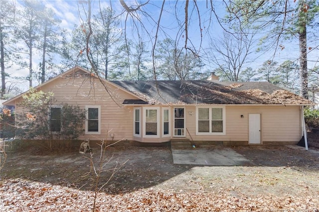 rear view of property featuring a patio area