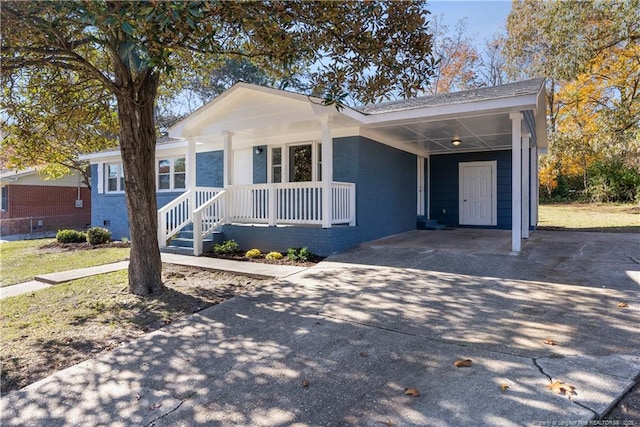 single story home featuring a carport