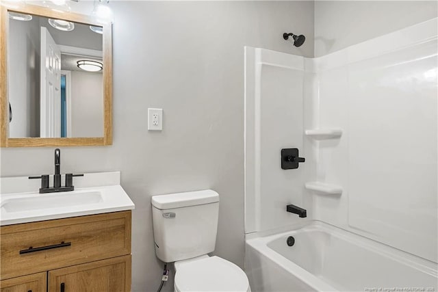 full bathroom with vanity, washtub / shower combination, and toilet