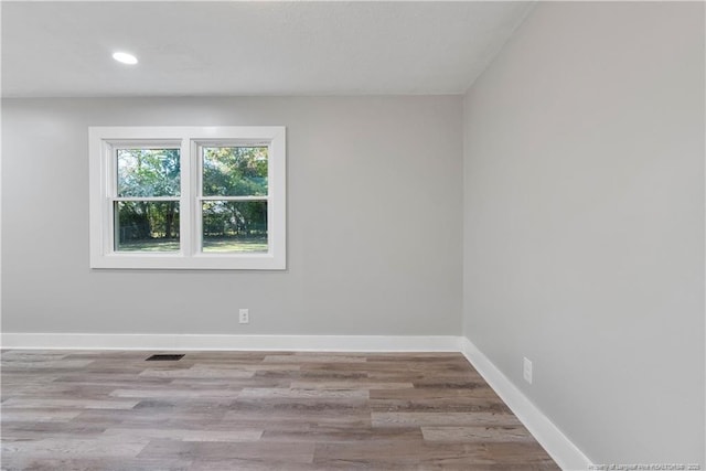 spare room with light hardwood / wood-style floors