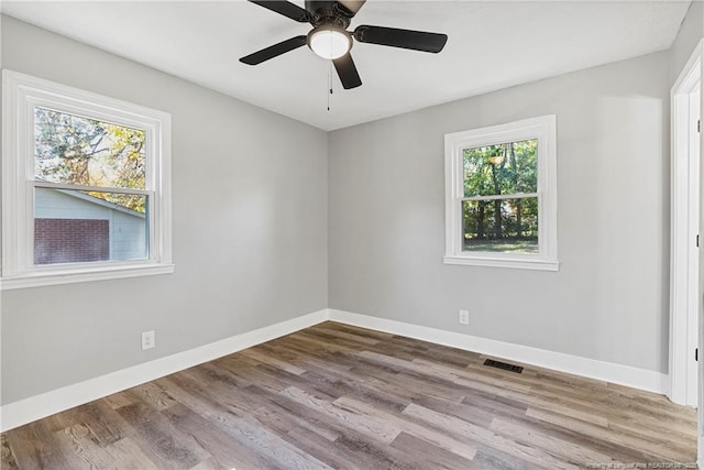 spare room featuring ceiling fan and light wood-type flooring