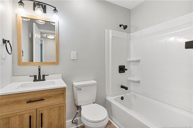 full bathroom featuring vanity, tub / shower combination, and toilet